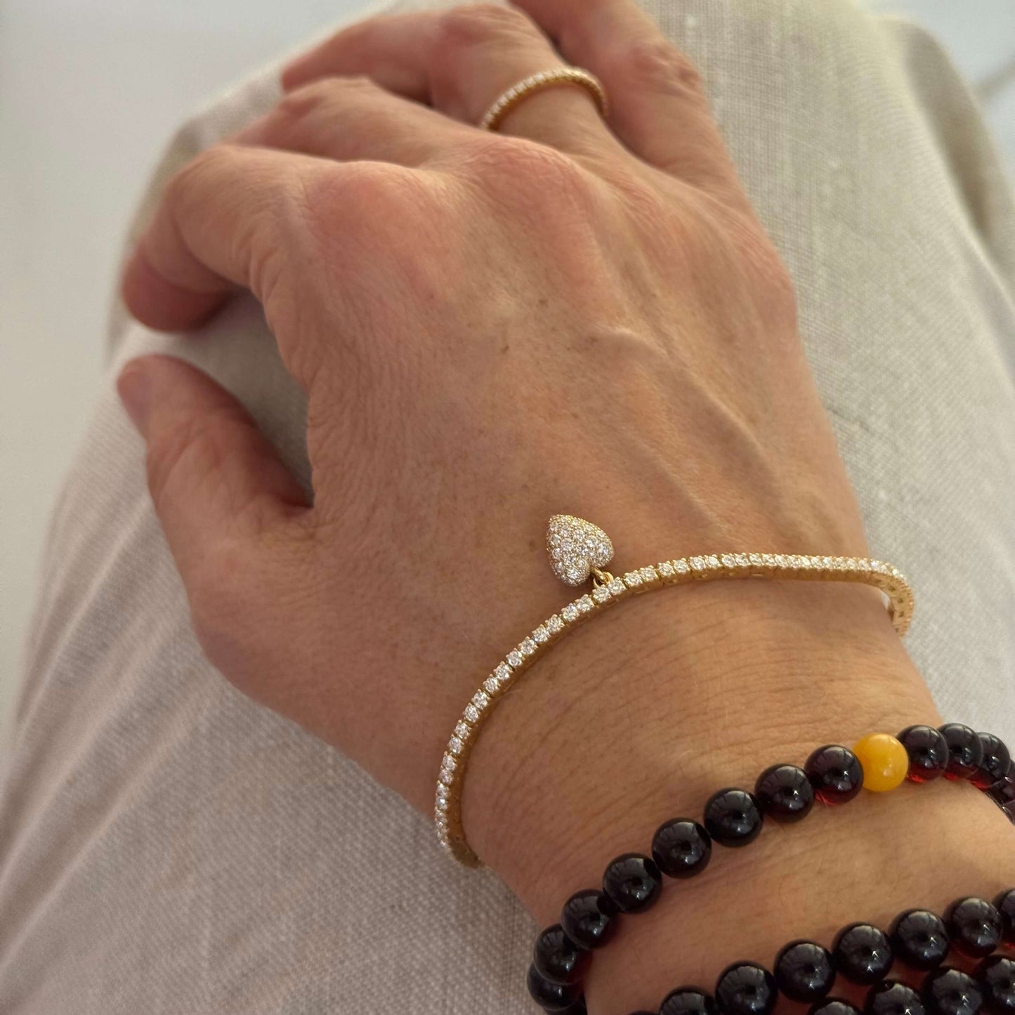 Tennis-Armband Gelbgold mit Herzanhänger